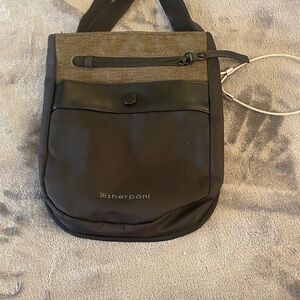 Sherpani Black and Brown Womans/Mens Messenger Crossbody. Has security chain